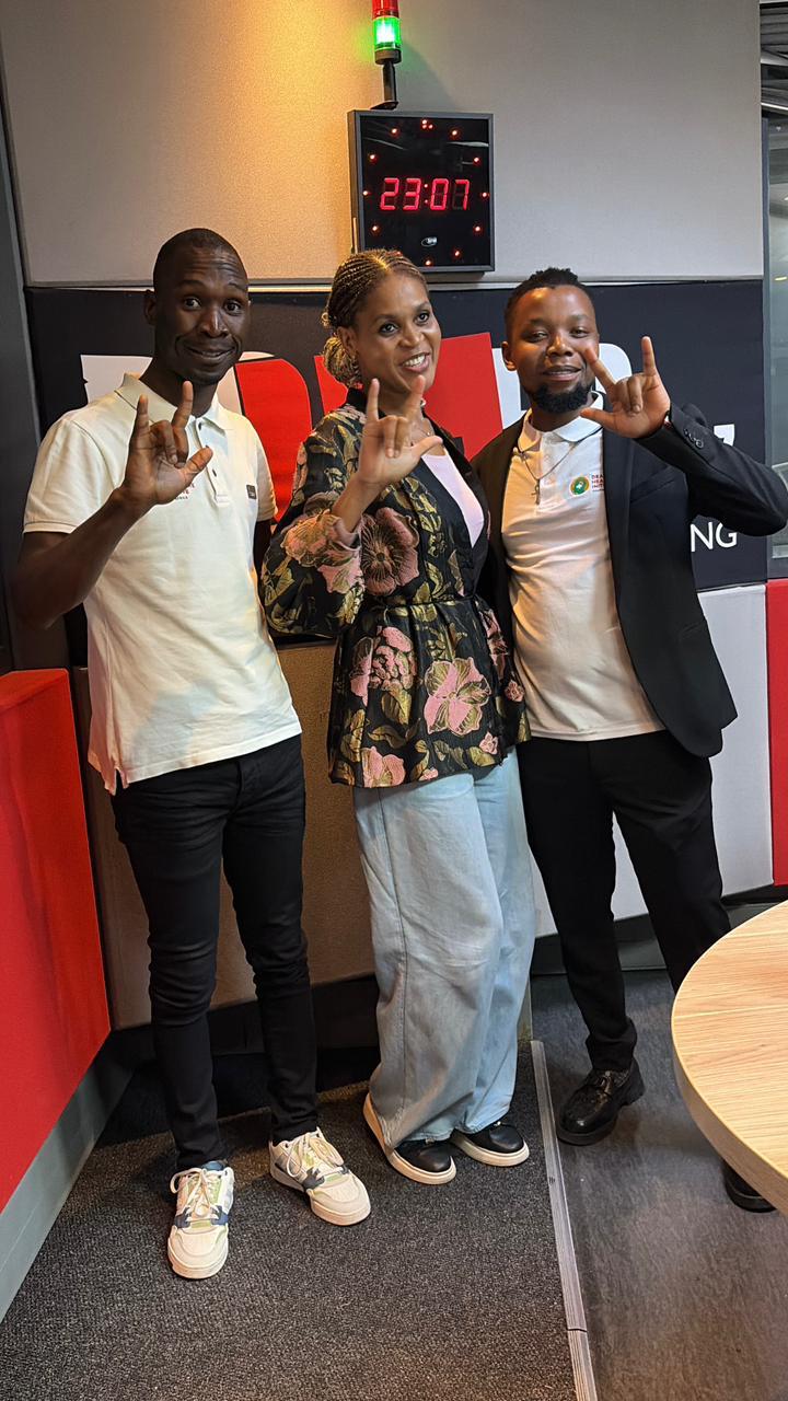 DCHI team members signing during a Power FM studio visit