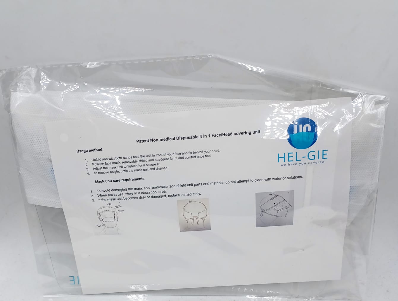 HG Mask packaging with the HEL-GIE instruction sheet describing the patented non-medical disposable 4-in-1 face/head covering unit.