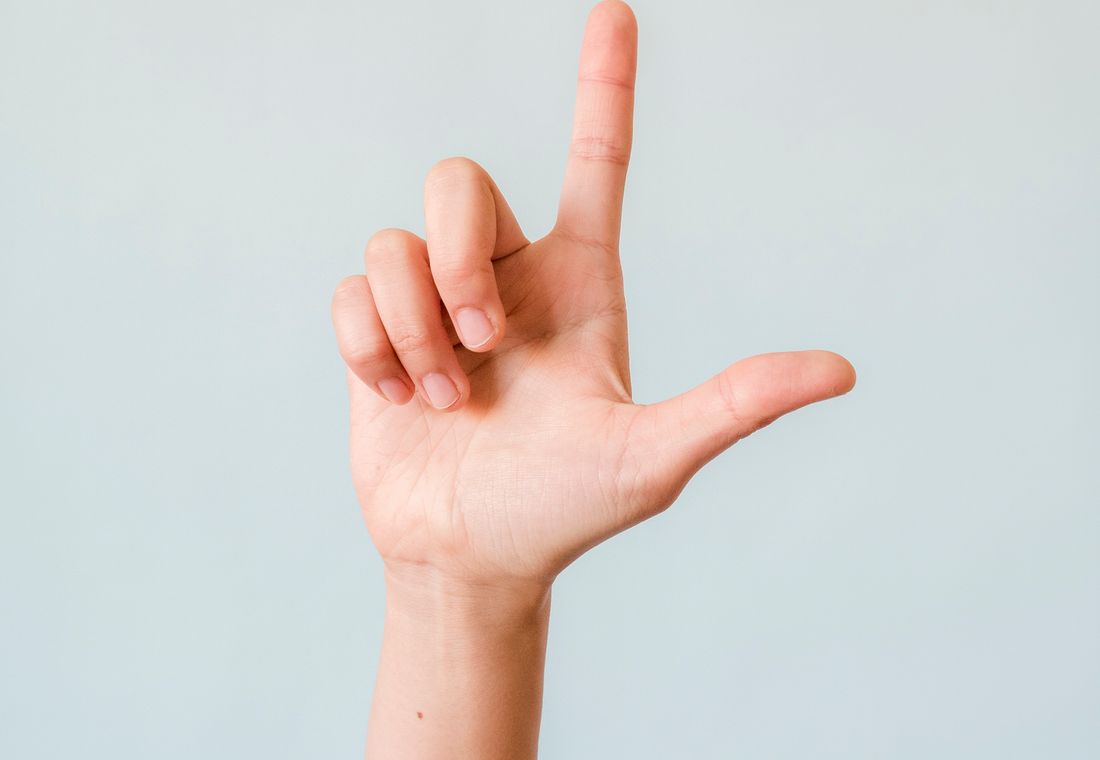 A person communicating in South African Sign Language